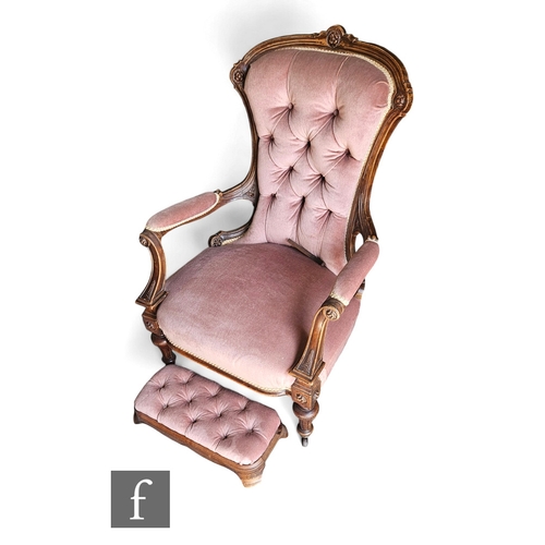 732 - A Victorian walnut scroll back easy chair, scroll open arms on turned fluted legs to the front, with... 