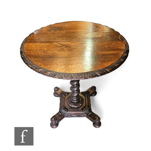 733 - A Victorian oak circular occasional table, the carved moulded edge top on a spiral pedestal and step... 