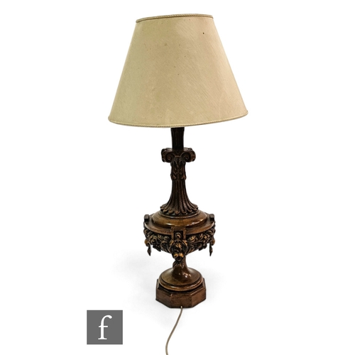 550 - A large 20th Century carved walnut table lamp, scroll capital mount over a fruiting turned octagonal... 