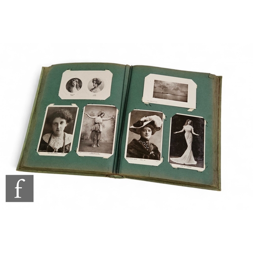 594 - An Edwardian postcard album containing postcards of theatrical stars to include Miss Zena Dare, Miss... 