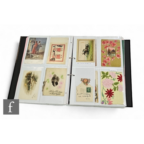 616 - An album containing a collection of valentines cards including early Victorian, greeting and postcar... 