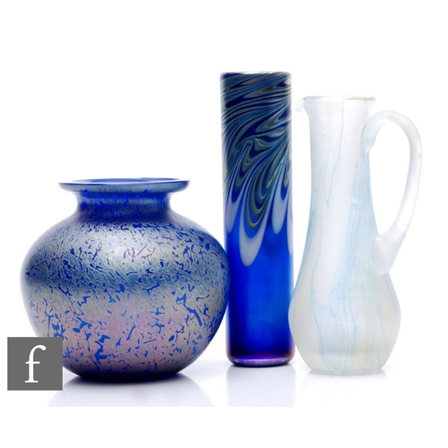 1161 - A later 20th Century studio glass vase designed by Karina Sellars, the tall cylindrical sleeve form ... 