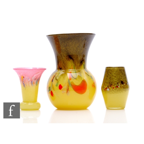 264 - A 20th Century Strathearn glass vase of spherical and flared form, the swirling yellow glass with mu... 