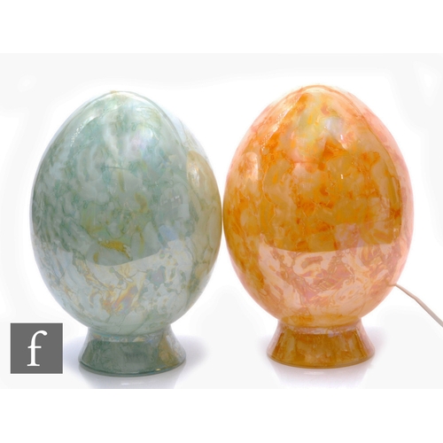 283 - A contemporary table lamp, egg form, with internal dappled green swirled decoration over clear glass... 