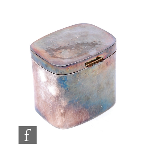 565 - An Arts and Crafts white metal cushioned rectangular tea caddy with planished decoration, height 9cm... 