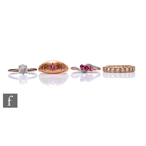 127 - An 18ct ruby three stone ring, weight 2.5g, with three further 9ct stone set rings, total weight 5.5... 