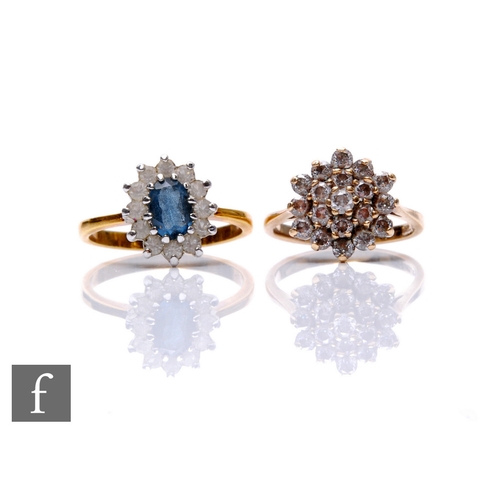 129 - A 9ct hallmarked paste set cluster ring, weight 3.4g, with a similar blue and white paste example. (... 