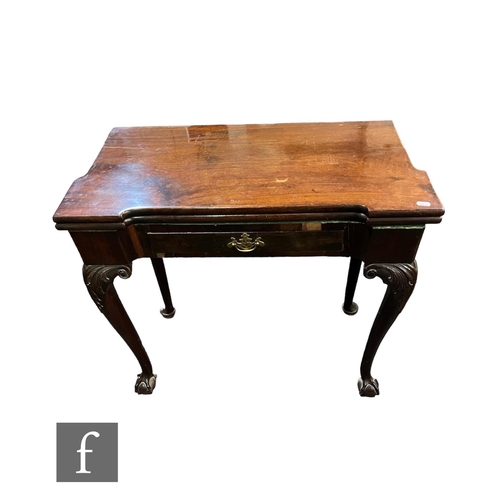 745 - A George III inverted breakfront mahogany fold over card table, fitted with a short drawer on carved... 