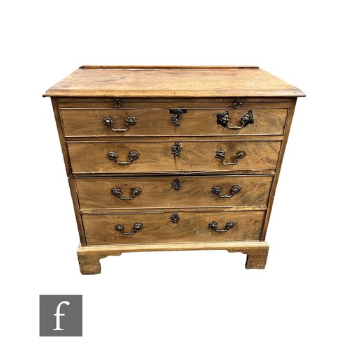 746 - A George III mahogany bachelor chest of four graduated drawers below a brushing slide, brass swan ne... 