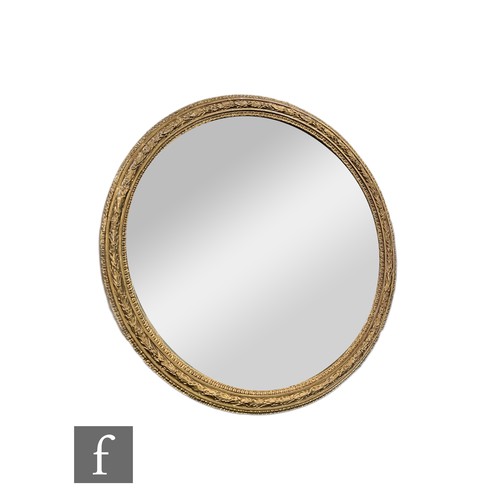 744 - A Victorian circular gilt bevelled edge wall mirror, raised leaf moulded frame, diameter 92cm.PLEASE... 