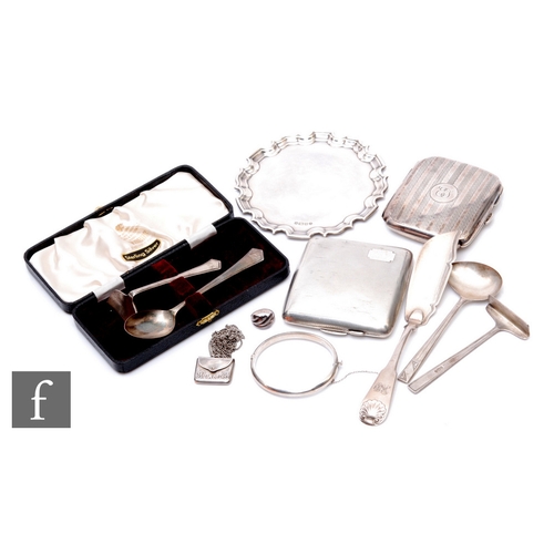 19 - A parcel lot of assorted hallmarked silver items to include cigarette cases, flat ware, a small wait... 