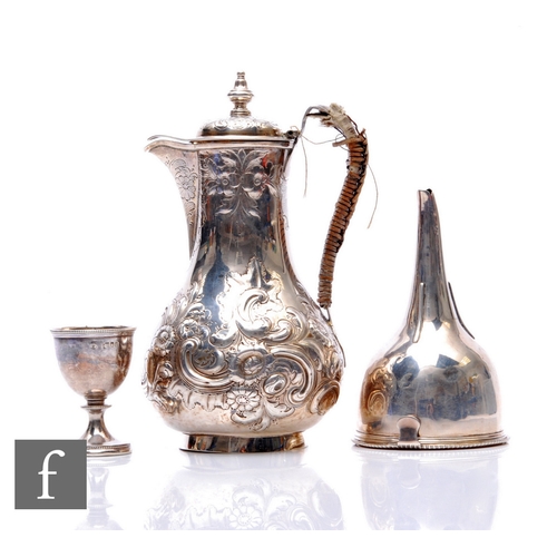 23 - Three items of hallmarked silver, a Georgian wine funnel, London 1805, a small jug, London 1855, and... 