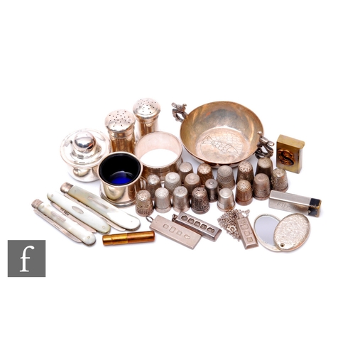 27 - A parcel lot of assorted silver and other items to include thimbles, napkin rings, folding fruit kni... 