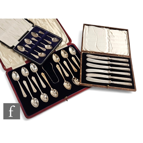 28 - A cased set of twelve tea spoons with a set of tongs and a further cased set of silver teaspoons and... 