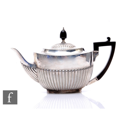 31 - A hallmarked silver boat shaped tea pot with part fluted decoration, weight 19oz, London 1908, Willi... 