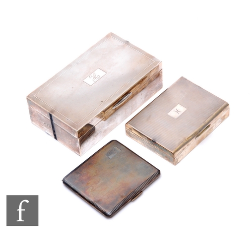 34 - Two hallmarked silver rectangular cigarette boxes with a silver cigarette case, various styles and d... 