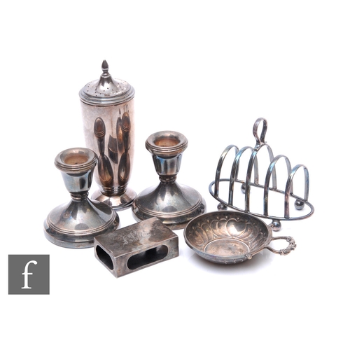 45 - A parcel lot of assorted hallmarked silver items to include a toast rack, wine taster, sugar castor,... 