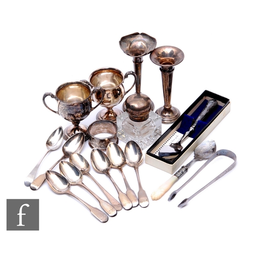 46 - A parcel lot of assorted hallmarked silver items to include two small trophy cups, flat ware, a silv... 