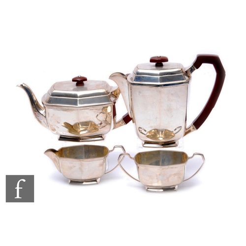 47 - An Art Deco hallmarked silver four piece tea set of plain faceted form, total weight 51.5oz, termina... 