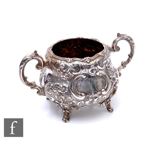 51 - A Victorian hallmarked silver twin handled sugar basin with embossed foliate decoration and raised o... 