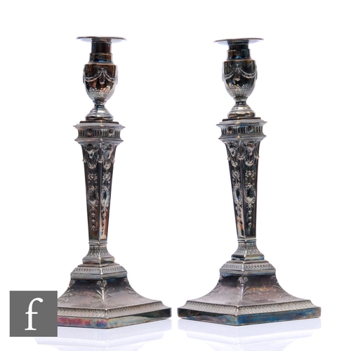 6 - A pair of 19th Century silver plated candlesticks with acanthus leaf detail to square bases and sway... 