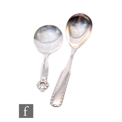 9 - A Danish silver Georg Jensen acorn pattern caddy spoon, import marks for 1925, with a similar rope p... 