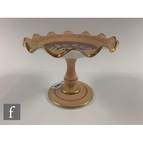 193 - A late 19th Century glass sweatmeat stand of circular form with crimped rim on baluster stem and cir... 