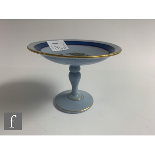 193 - A late 19th Century glass sweatmeat stand of circular form with crimped rim on baluster stem and cir... 