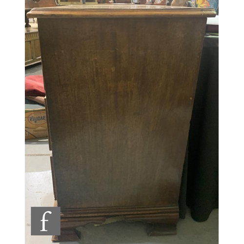 655 - A George III mahogany straight front chest of three long graduated drawers below a moulded edge top,... 