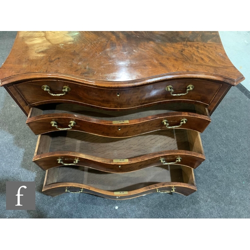 679 - A George III mahogany serpentine chest of four long graduated drawers, the upper drawer with a fitte... 