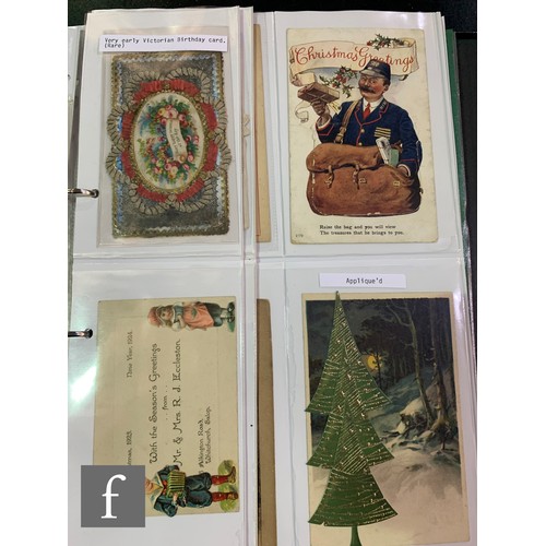 616 - An album containing a collection of valentines cards including early Victorian, greeting and postcar... 