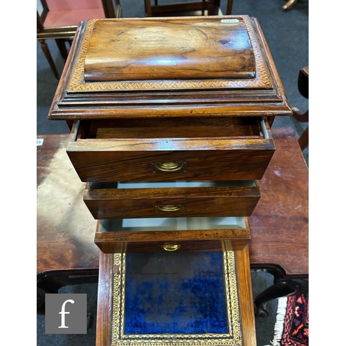 747 - A Victorian figured walnut table cabinet fitted with three drawers, recessed brass handles, enclosed... 