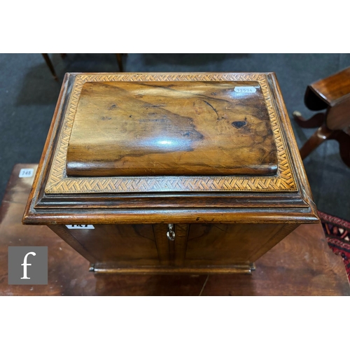 747 - A Victorian figured walnut table cabinet fitted with three drawers, recessed brass handles, enclosed... 