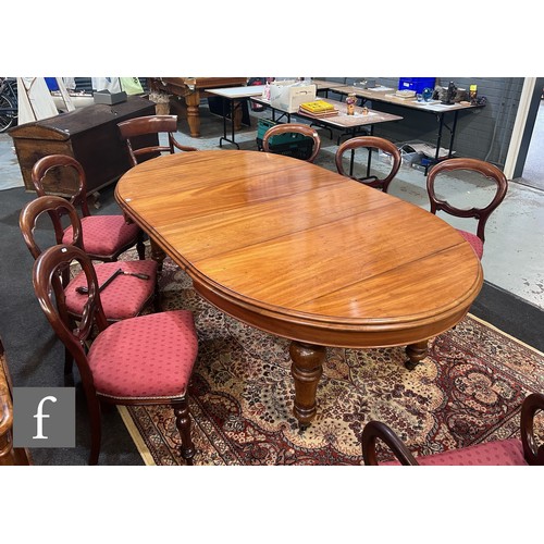 717 - A Victorian oval extending mahogany dining table, the double moulded edge top over a plain frieze, o... 