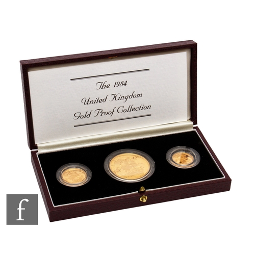 403 - Elizabeth II - A 1984 half sovereign to five pound three coin set, with certificate, cased.