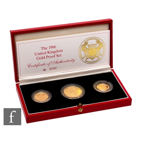 405 - Elizabeth II - A 1986 half sovereign to two pound three coin set, with certificate, cased.