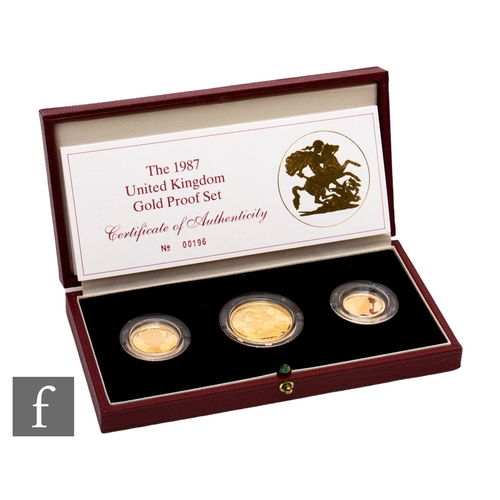 406 - Elizabeth II - A 1987 half sovereign to two pound three coin set, with certificate, cased.