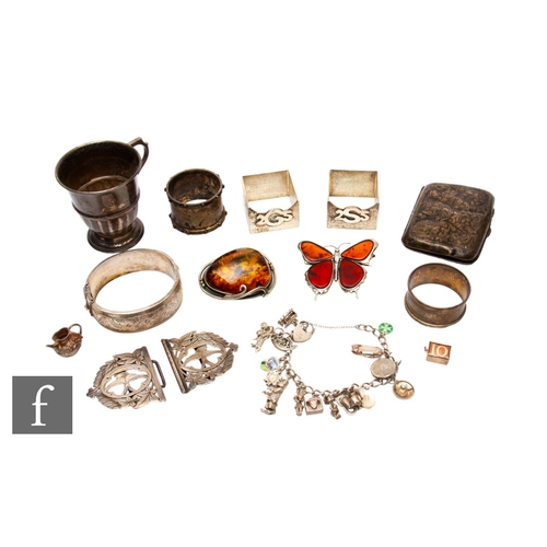 68 - A small parcel lot of hallmarked silver items, four napkin rings, a christening cup and a cigarette ... 