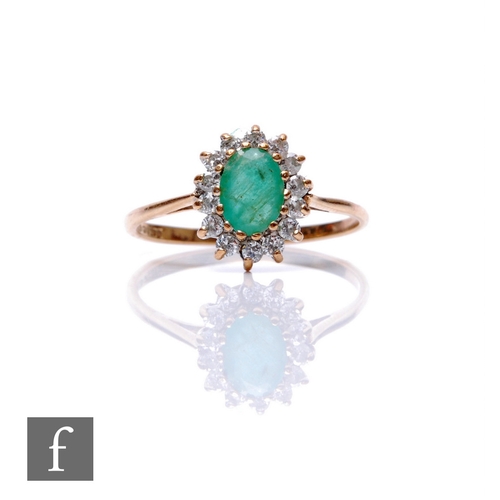 250 - A 9ct hallmarked emerald and diamond cluster ring, central oval emerald within a diamond surround, w... 