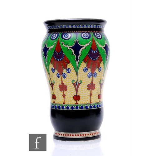 60 - A large 1930s Gouda Ware vase of footed swollen ovoid form hand enamelled with stylised foliate scro... 