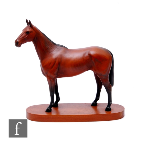 108 - A Beswick model of a racehorse, Arkle Champion Steeplechaser, matt brown/black glaze, on oval wooden... 