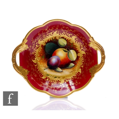 87 - A Coalport fruit painted twin handled bowl by Manfred Pinter, of circular lobed form with foliate mo... 