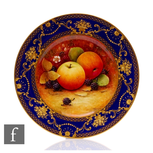 88 - A Coalport fruit painted plate by Malcolm Hartnett, decorated with apples and blackberries on a moss... 