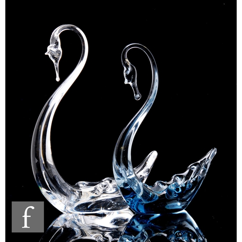 219 - A Whitefriars pewter glass swan, height 20.5cm, together with a clear glass example, height 23cm. (2... 