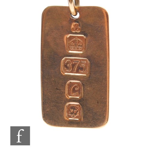 255 - A 9ct hallmarked cushioned rectangular ingot, weight 15g, terminating in pendant loop.