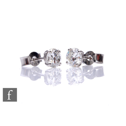 256 - A pair of 9ct white gold four claw diamond brilliant cut stud earrings, each approximately 0.50ct, c... 