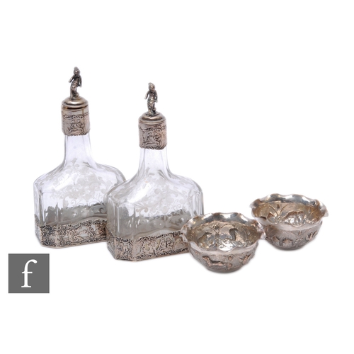 86 - Two 19th Century Dutch silver mounted mallet shaped cologne bottles with etched foliate scroll decor... 