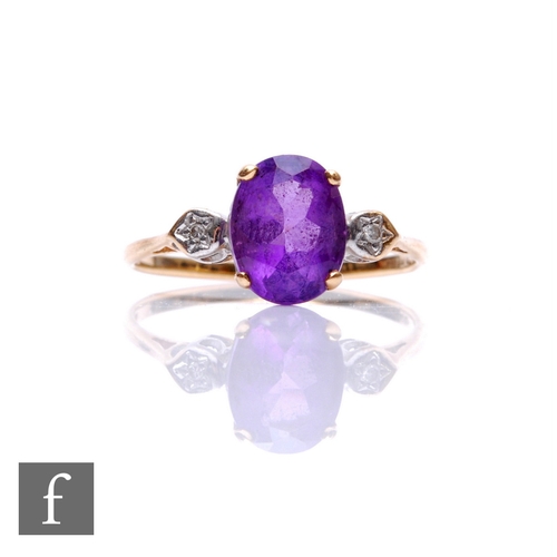 265 - A 9ct hallmarked amethyst and diamond three stone ring, central amethyst with a single diamond to ea... 