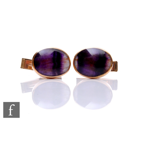 279 - A pair of 9ct gold and Blue John cufflinks of oval cabochon form, 1.5cm, Birmingham 1972.