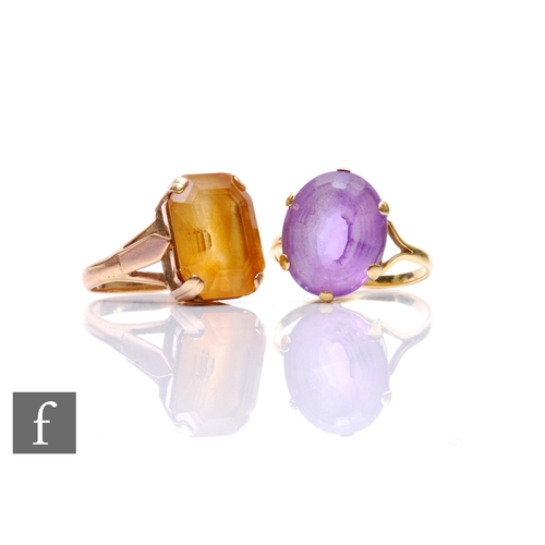 280 - Two yellow metal stone set dress rings, each set with a yellow and purple facet cut stone, 1.5cm, ri... 